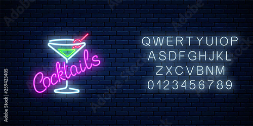 Neon cocktails bar or cafe sign with alphabet. Glowing gas advertising with glass of alcohol shake.
