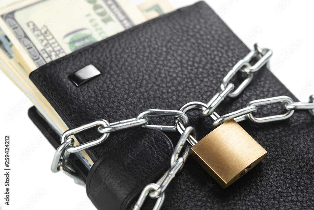 Concept of business safety or financial protection or restriction access. Wallet in chain with padlock isolated on white Concept of business safety or financial protection or restriction access. Wallet in chain with padlock isolated on white