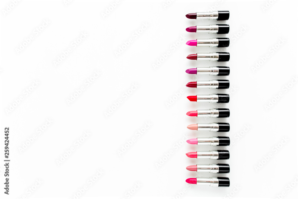 Set of color lipsticks on white background. Professional decorative cosmetics, promotional product pomade for advertising. Flat composition beauty, fashion. flat lay, top view Set of color lipsticks on white background. Professional decorative cosmetics, promotional product pomade for advertising. Flat composition beauty, fashion. flat lay, top view