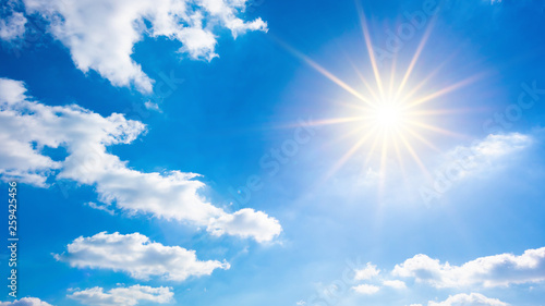 Hot summer or heat wave background  wonderful blue sky with glowing sun