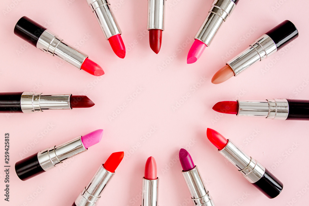 Set of color lipsticks on pink background. Professional decorative cosmetics. Flat composition beauty, fashion. flat lay, top view Set of color lipsticks on pink background. Professional decorative cosmetics. Flat composition beauty, fashion. flat lay, top view