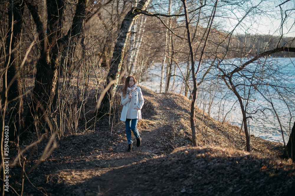 Portrait of a girl with willow branches in early spring at sunset. Portrait of a girl with willow branches in early spring at sunset.