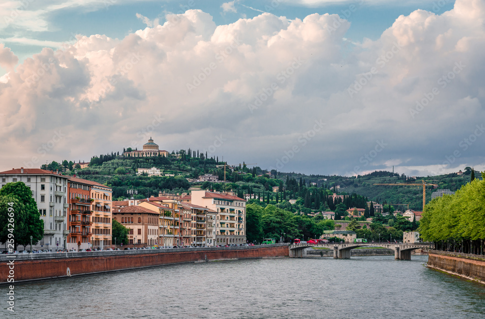 View of Verona from Ponte della Vittoria, a bridge that spans river Adige. Verona is a historic city in Veneto, Italy and a very popular tourist destination. View of Verona from Ponte della Vittoria, a bridge that spans river Adige. Verona is a historic city in Veneto, Italy and a very popular tourist destination.