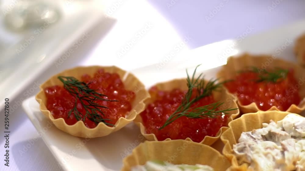 Tartlets with red caviar. Selective focus, serve red caviar. Tartlets with red caviar. Selective focus, serve red caviar.