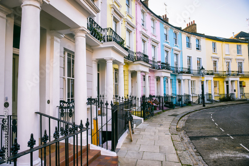 Scenic London, England view with pastel colored buildings on an empty curved street