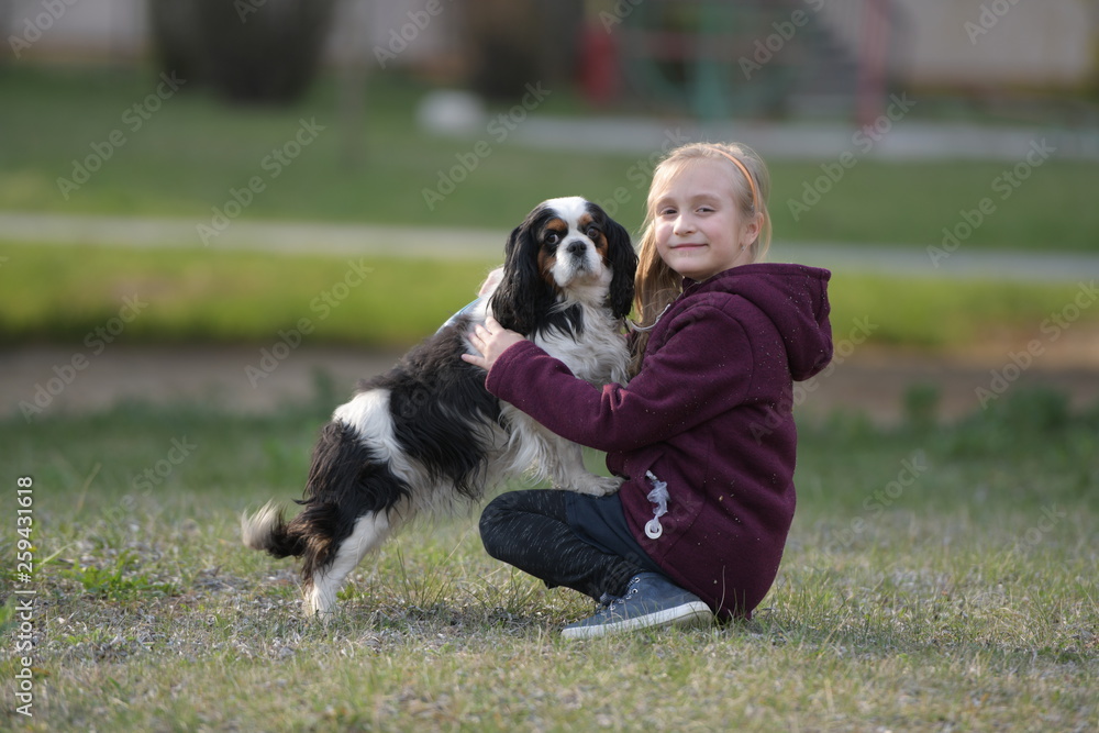 happy child girl with her dog