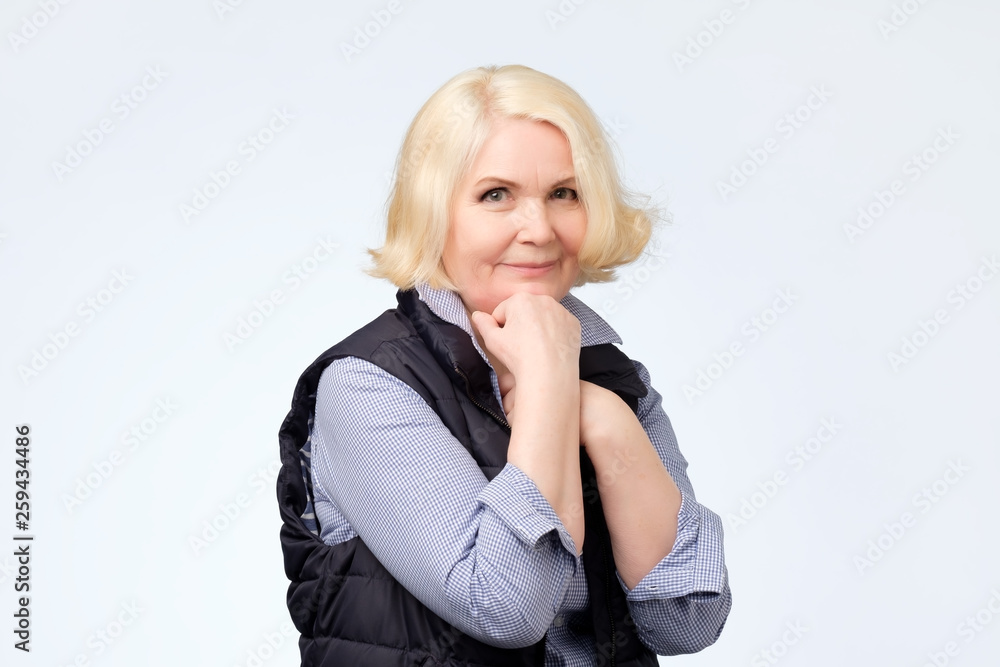 Friendly smiling senior woman in active sport clothes Friendly smiling senior woman in active sport clothes