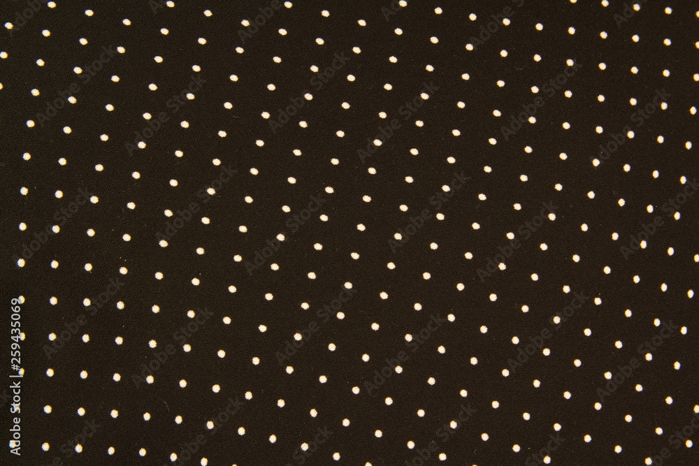 Texture of a black and white small polka dot fabric Texture of a black and white small polka dot fabric