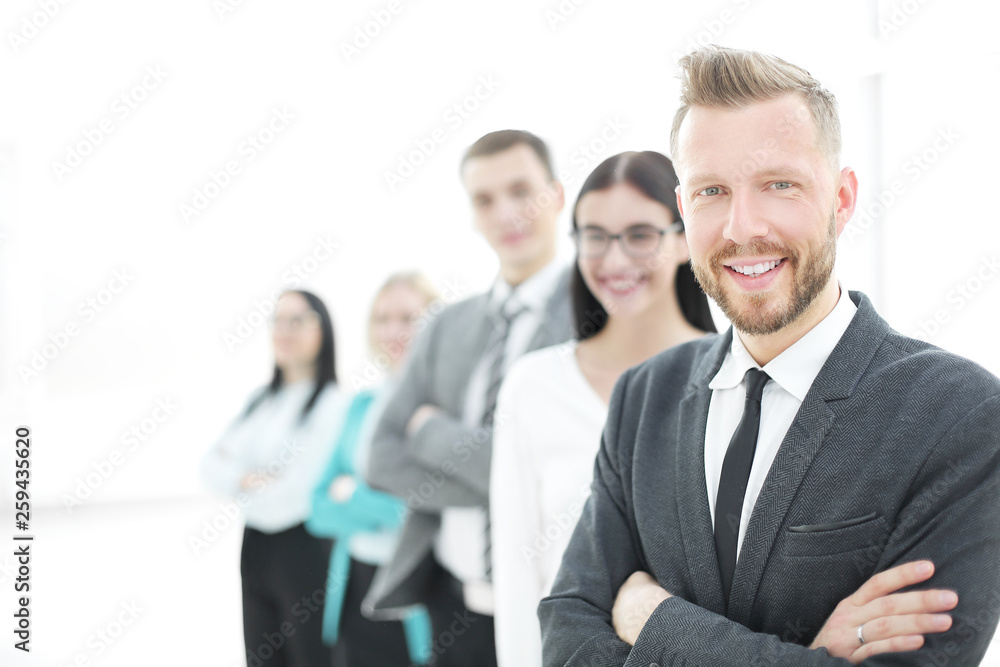 confident businessman standing in front of his business team confident businessman standing in front of his business team