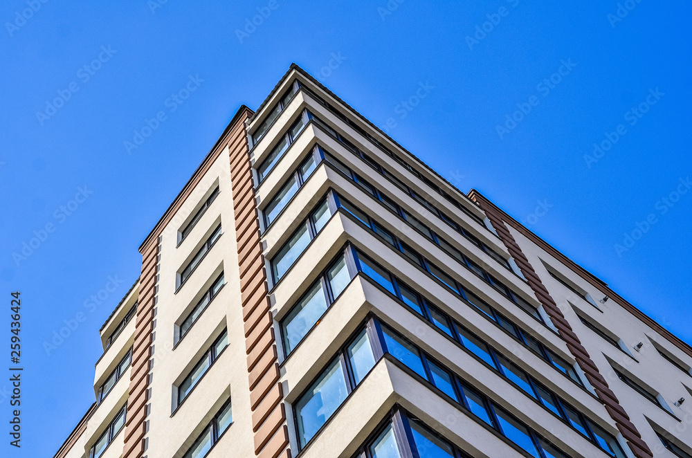 Detail of a new condomunium complex on the background of blue sky Detail of a new condomunium complex on the background of blue sky