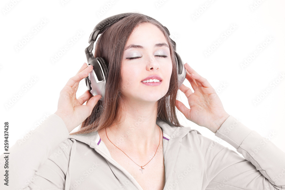 closeup. modern young woman in headphones . isolated on a white closeup. modern young woman in headphones . isolated on a white