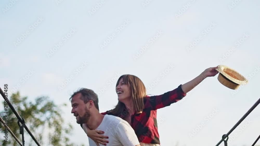 The guy and the girl happily spend time outdoors.