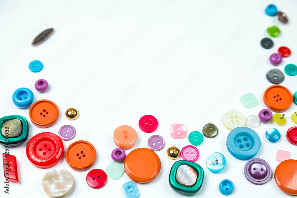 Set of vintage buttons of different flowers and sizes. Buttons are laid out on a white background. The place for copyspase