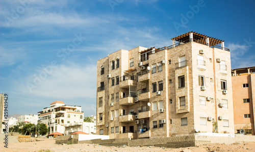dwelling house building of East modern architecture in one of third world poor country outdoor environment in residential area on the edge of a city