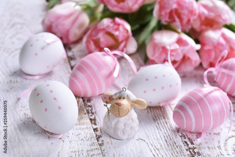 easter decoration with painted eggs and pink tulips easter decoration with painted eggs and pink tulips