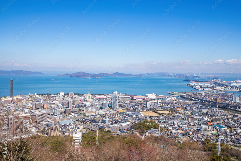 Naklejka premium Cityscape of utazu town and Seto ohashi bridge ,Shikoku,Japan