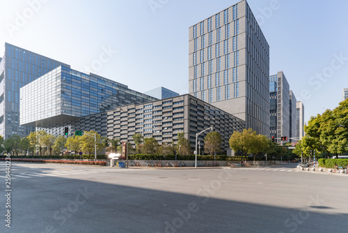 Modern business office buildings with empty road, empty concrete square floor