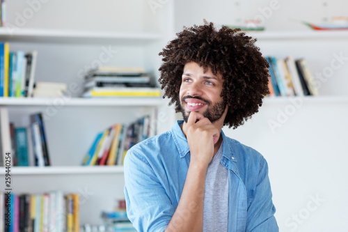 Thinking hipster man with afro hair