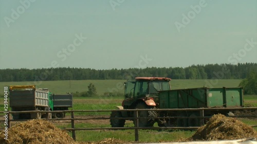 Tractor and truck are in the field. Lunch break. Work in the fields on the farm.