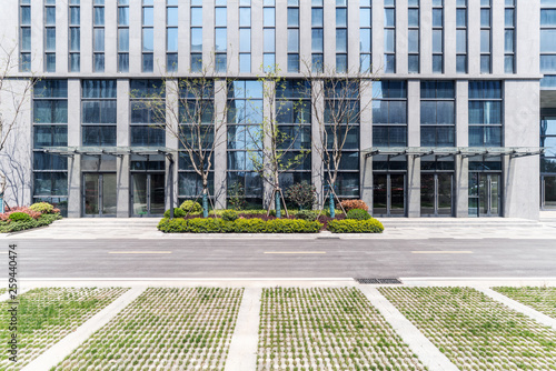 Obraz na płótnie Modern business office buildings with empty road, empty concrete square floor w salonie