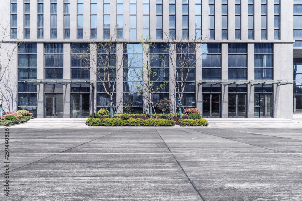 Modern business office buildings with empty road, empty concrete square floor