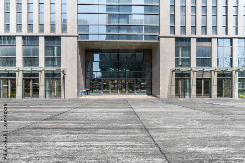 Modern business office buildings with empty road, empty concrete square floor