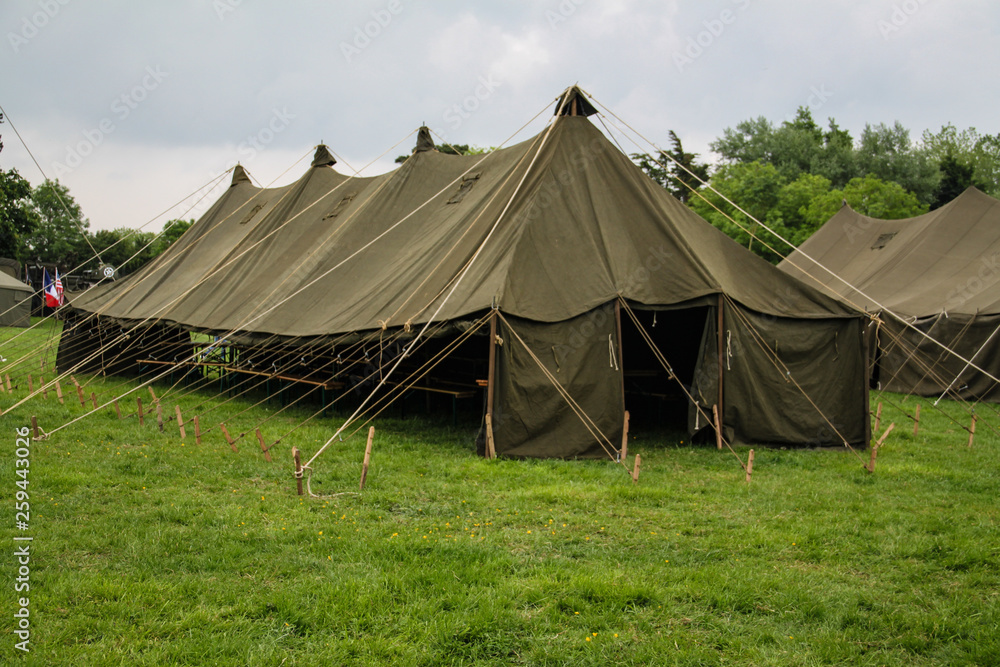 Normandy, France; 4 June 2014: View of recreation camp in Normandy for the 70th anniversary with vehicles and tents Normandy, France; 4 June 2014: View of recreation camp in Normandy for the 70th anniversary with vehicles and tents