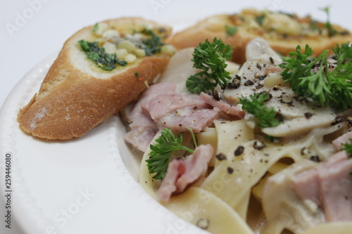 Italian Food, Fettuccine Alfredo, Italian Cream Sauce with Mushroom and Ham, topped with Parsley