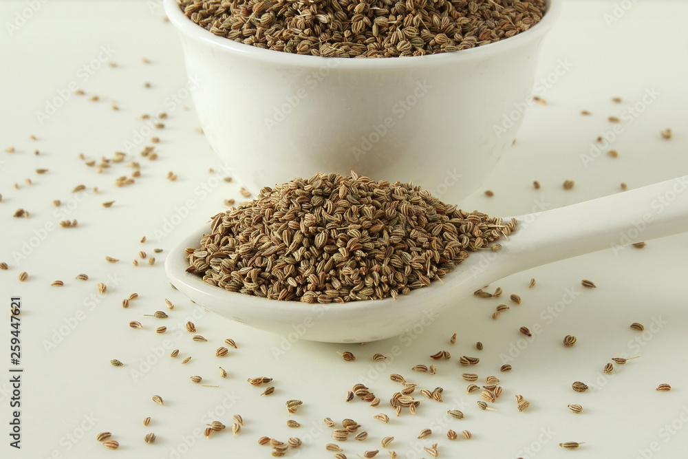 ajwain or Trachyspermum ammi,caraway herb spice seeds in bowl and spoon ajwain or Trachyspermum ammi,caraway herb spice seeds in bowl and spoon