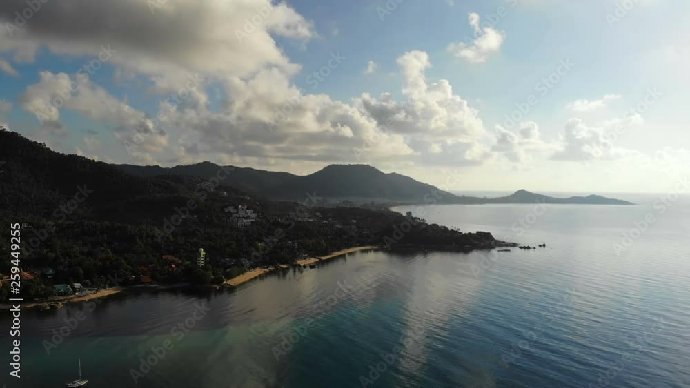 Aerial view of tropical sea and beach on white cloud and blue sky Aerial view of tropical sea and beach on white cloud and blue sky