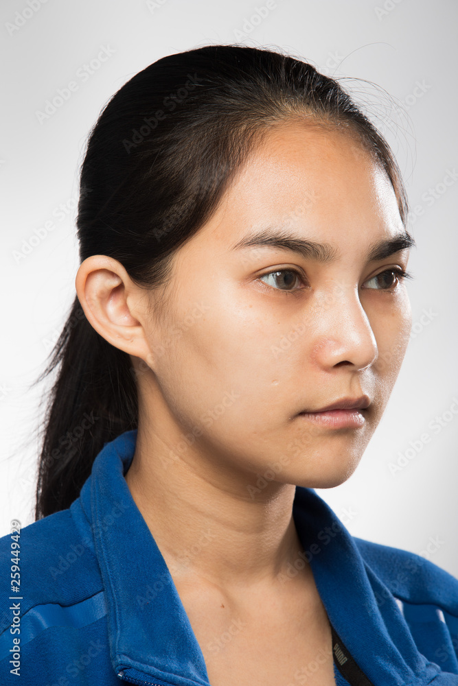 Asian Woman before applying make up hair style. no retouch, fresh face with acne, lips, eyes, cheek, nice smooth skin. Studio lighting white background, for aesthetics therapy treatment Asian Woman before applying make up hair style. no retouch, fresh face with acne, lips, eyes, cheek, nice smooth skin. Studio lighting white background, for aesthetics therapy treatment