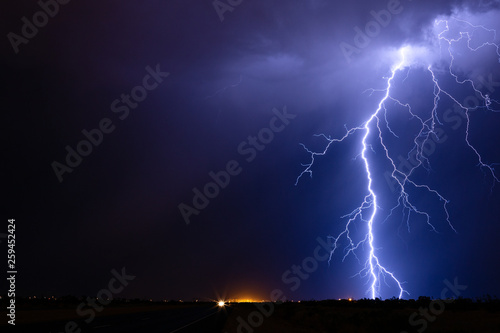 Bright thunderstorm lightning bolt strike