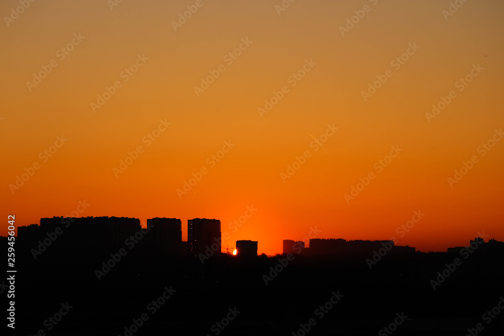 Silhouette of urban landscape at the sunrise