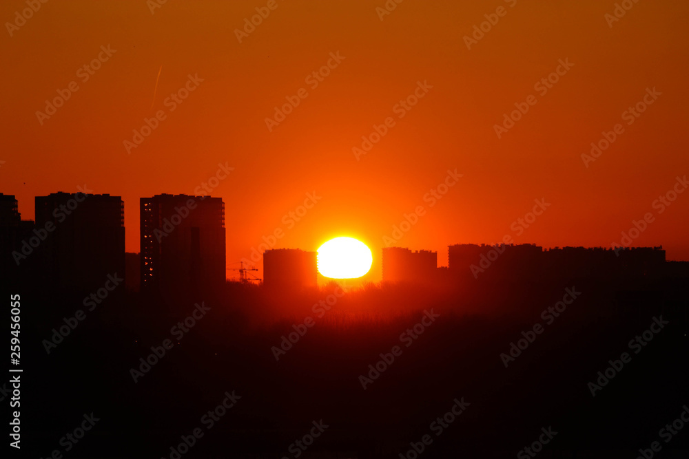 Urban silhouette orange dawn landscape