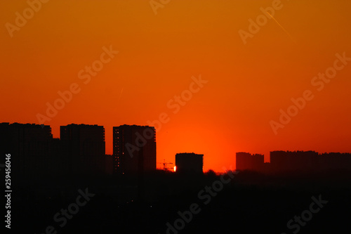 Obraz na płótnie Silhouette of urban landscape at the sunrise w salonie