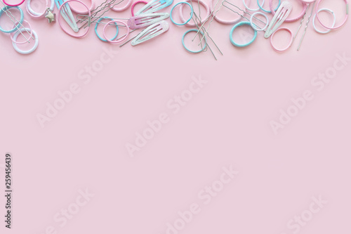 Hair scrunchies and hairpins on pink background, beauty concept, flat lay © Halina