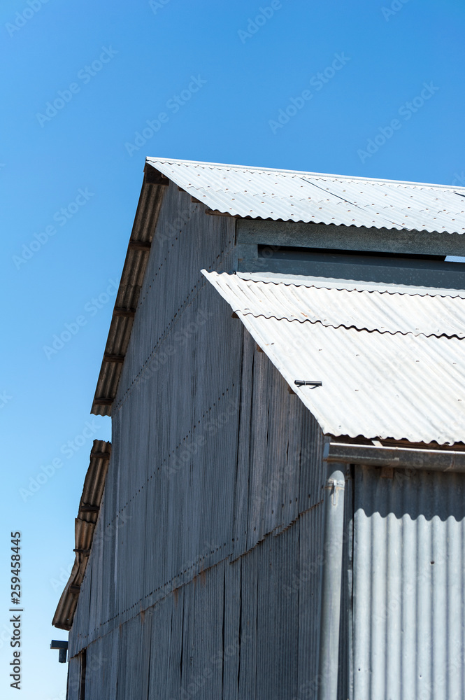 Old corrugated iron wool shed on outback station in Australia
