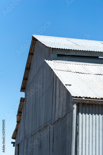Old corrugated iron wool shed on outback station in Australia © Andrew Atkinson