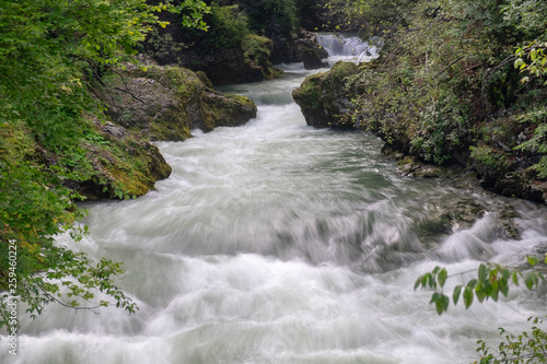 Long exposure photo of raging river at Vintgar Gorge canyon. Slovenia