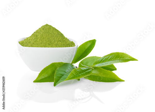 Green tea powder and green tea leaf isolated on white.