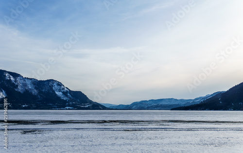 Early spring evening landscape of frozen Little Shuswap Lake British Columbia Canada. © olegmayorov
