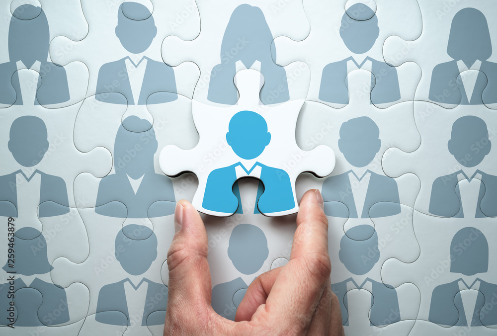 Selecting person and building team. Business people relationship  concept.Connecting last jigsaw puzzle piece. Stock Photo
