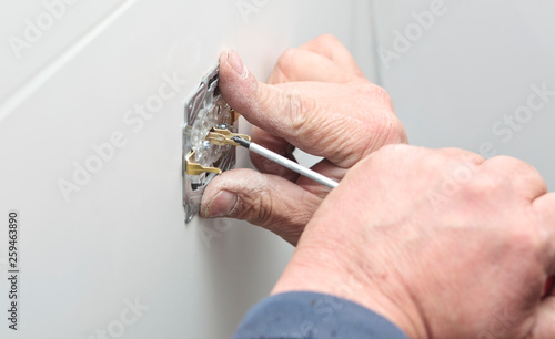 The process of installation of electrical sockets by electrician