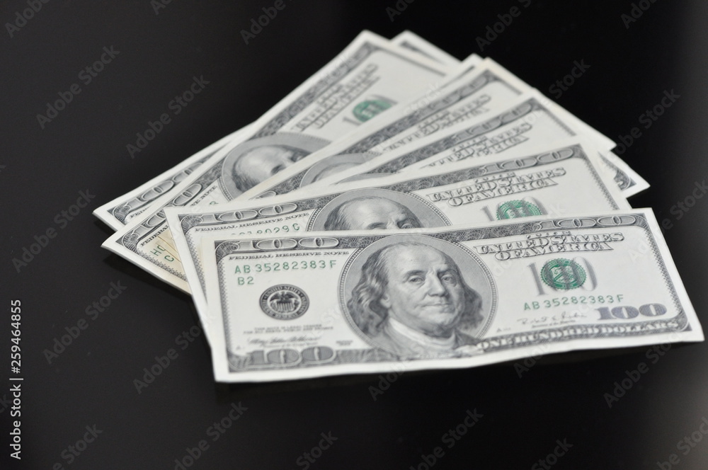 fan of american dollars on black background. financial concept fan of american dollars on black background. financial concept