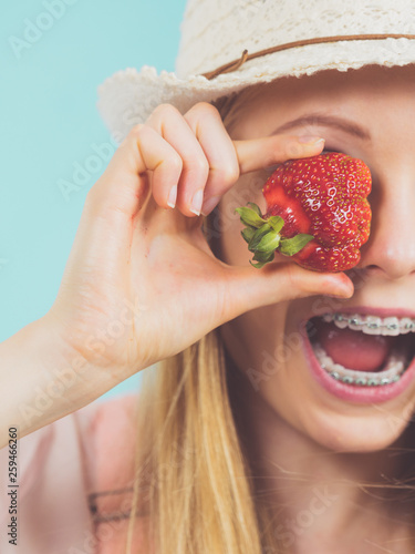 Young woman with fresh strawberries