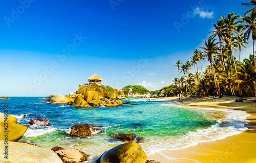 Beautiful bay with white sand beach and blue water in Tayrona national park in Colombia