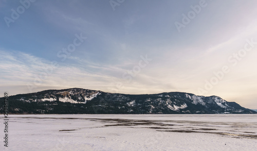 Early spring evening landscape of frozen Little Shuswap Lake British Columbia Canada. © olegmayorov