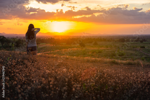 ํัYoung woman in a field and sunlight