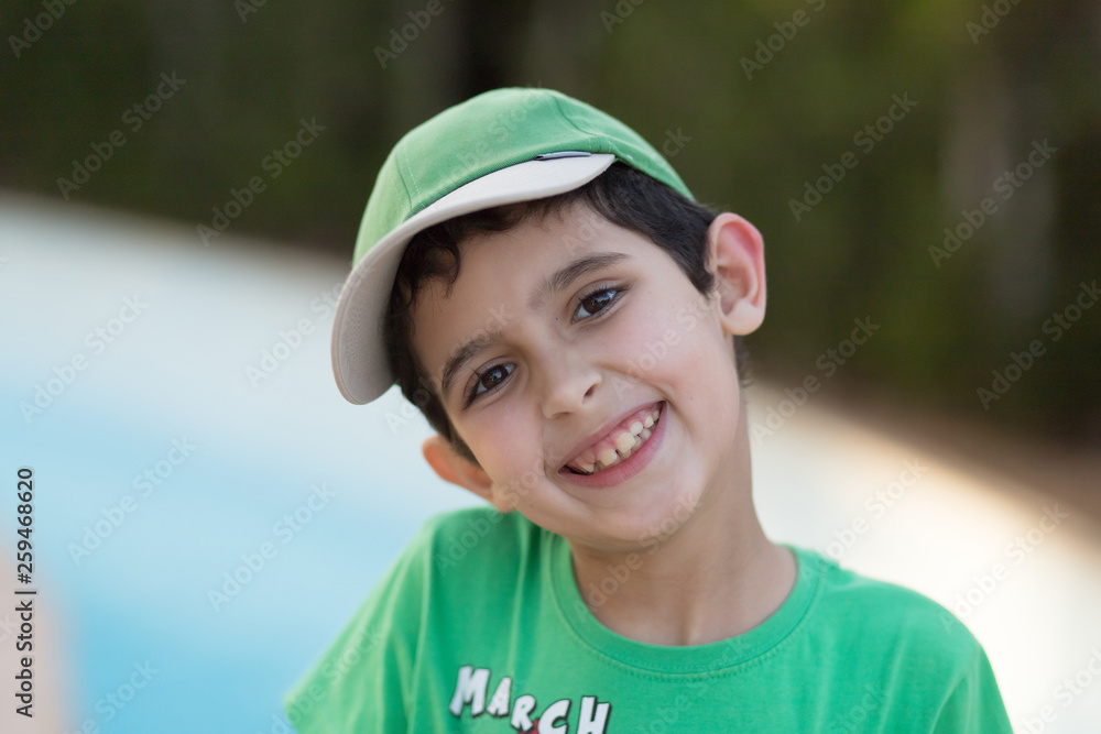 The boy playing table tennis in green t-shirt The boy playing table tennis in green t-shirt