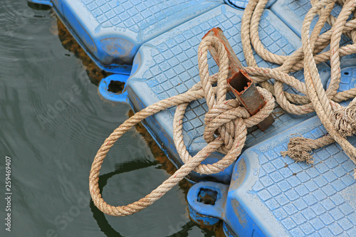 Pile of ship rope on floating pontoon.